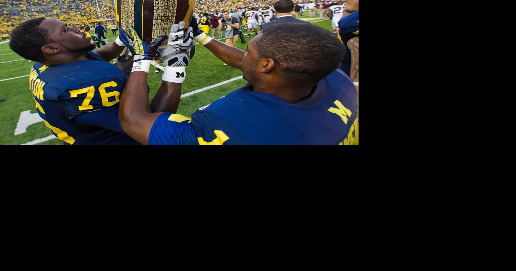 Meet the rivalry trophies of college football