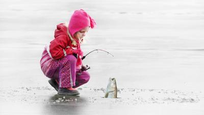 Little girl ice fishing