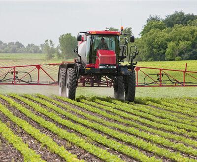 Tractor Spraying Soybean Field