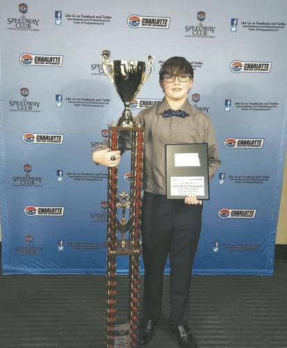 Collin Compson with Racing Trophy