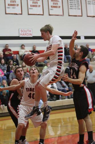 DISTRICT BOYS BASKETBALL: Tigers make an early tourney exit Sports