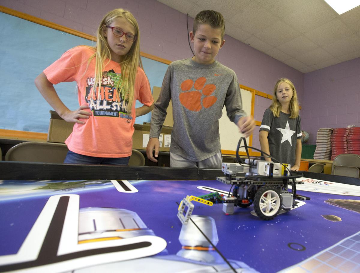 Brooks Elementary robotics team gets visit from the Department of