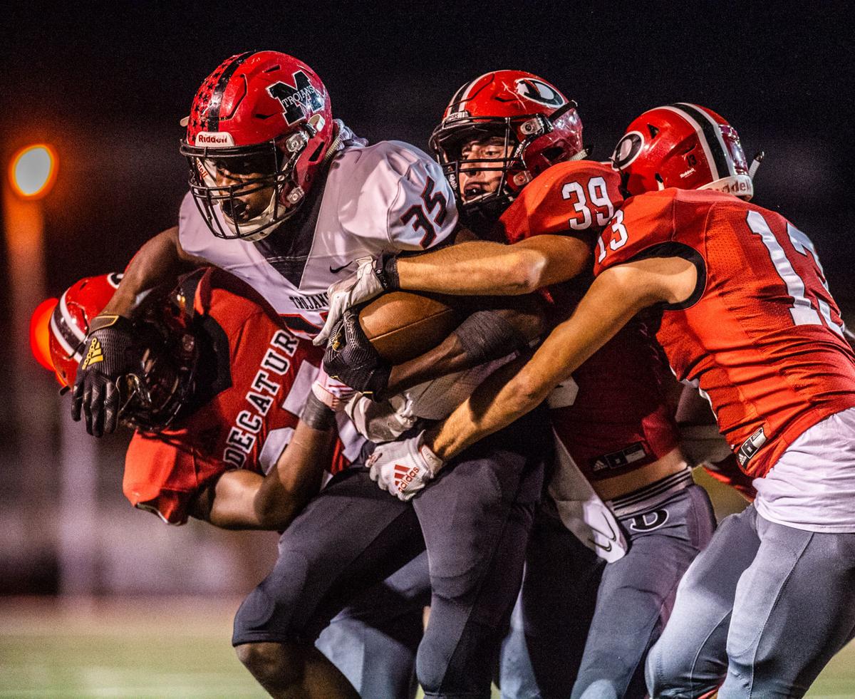 MUSCLE SHOALS 49, DECATUR 13 Trojans roll to seventh win in a row