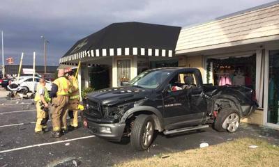Collision Sends Parked Pickup Into Muscle Shoals Store Window