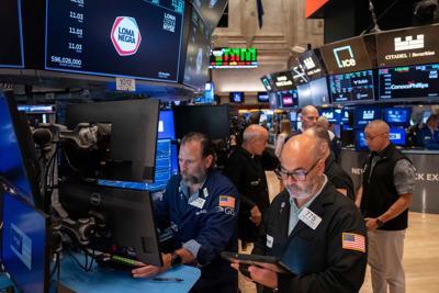 Wall Street rises near a record as AI stocks climb