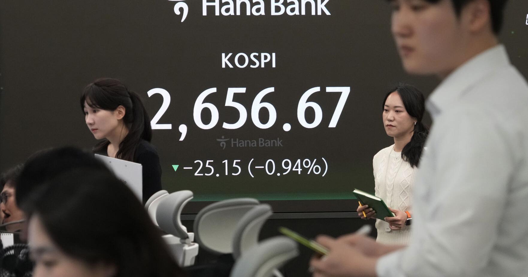 Stock market today: Asian shares track Wall Street slump triggered by strong US spending data
