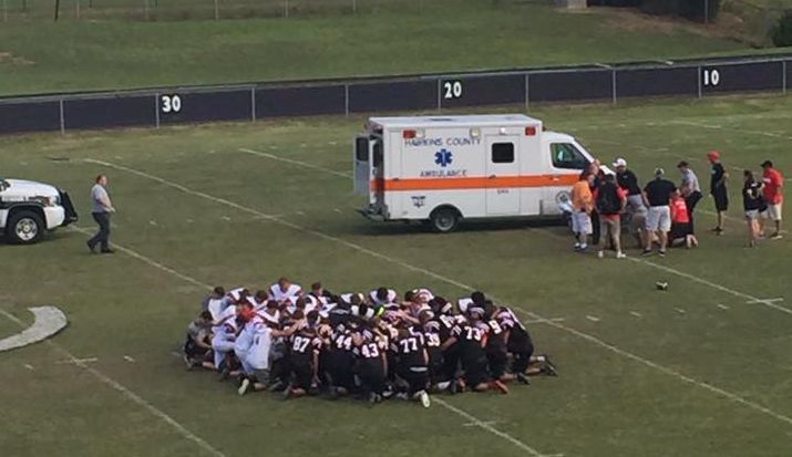 Friends and family of injured Cherokee High football player hold