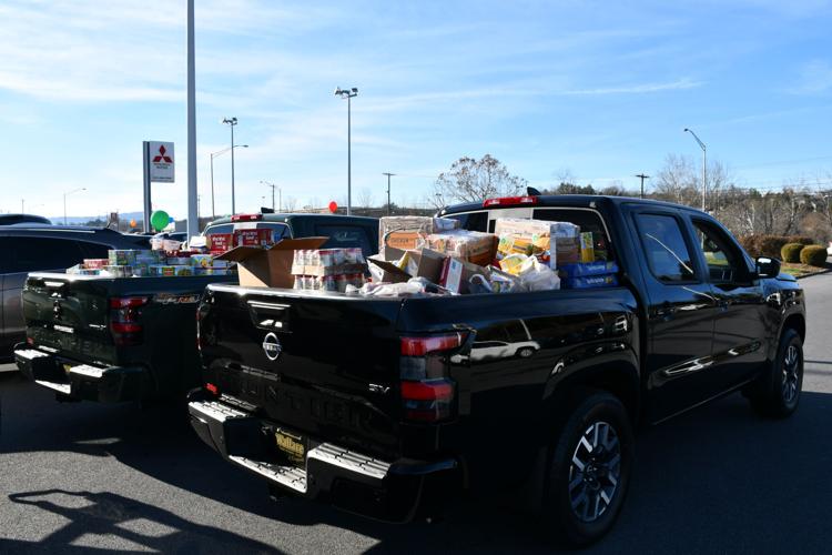 Wallace Nissan Mitsubishi donate trucks of food to Second Harvest, Fill