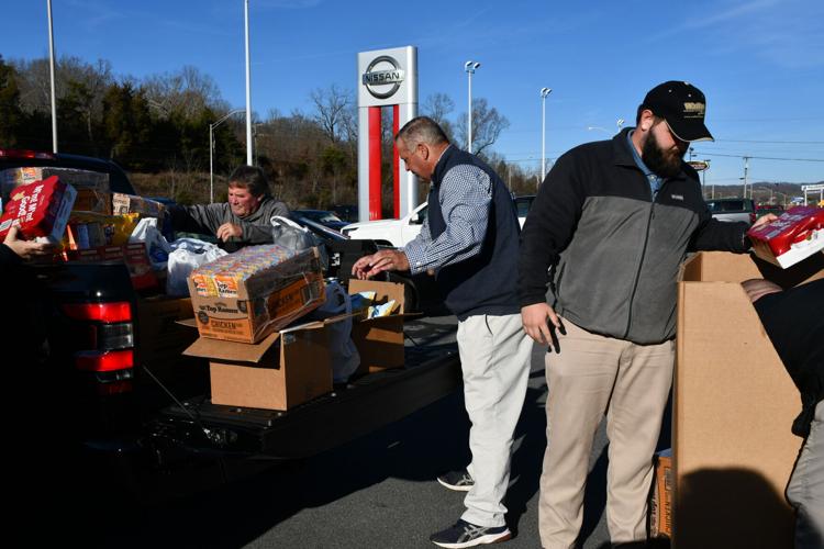 Wallace Nissan Mitsubishi donate trucks of food to Second Harvest, Fill