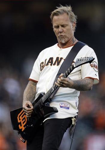 James Hetfield of Metallica receives a San Jose Sharks jersey at
