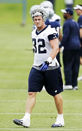 Former Dallas Cowboy Jason Witten, left center, now the football