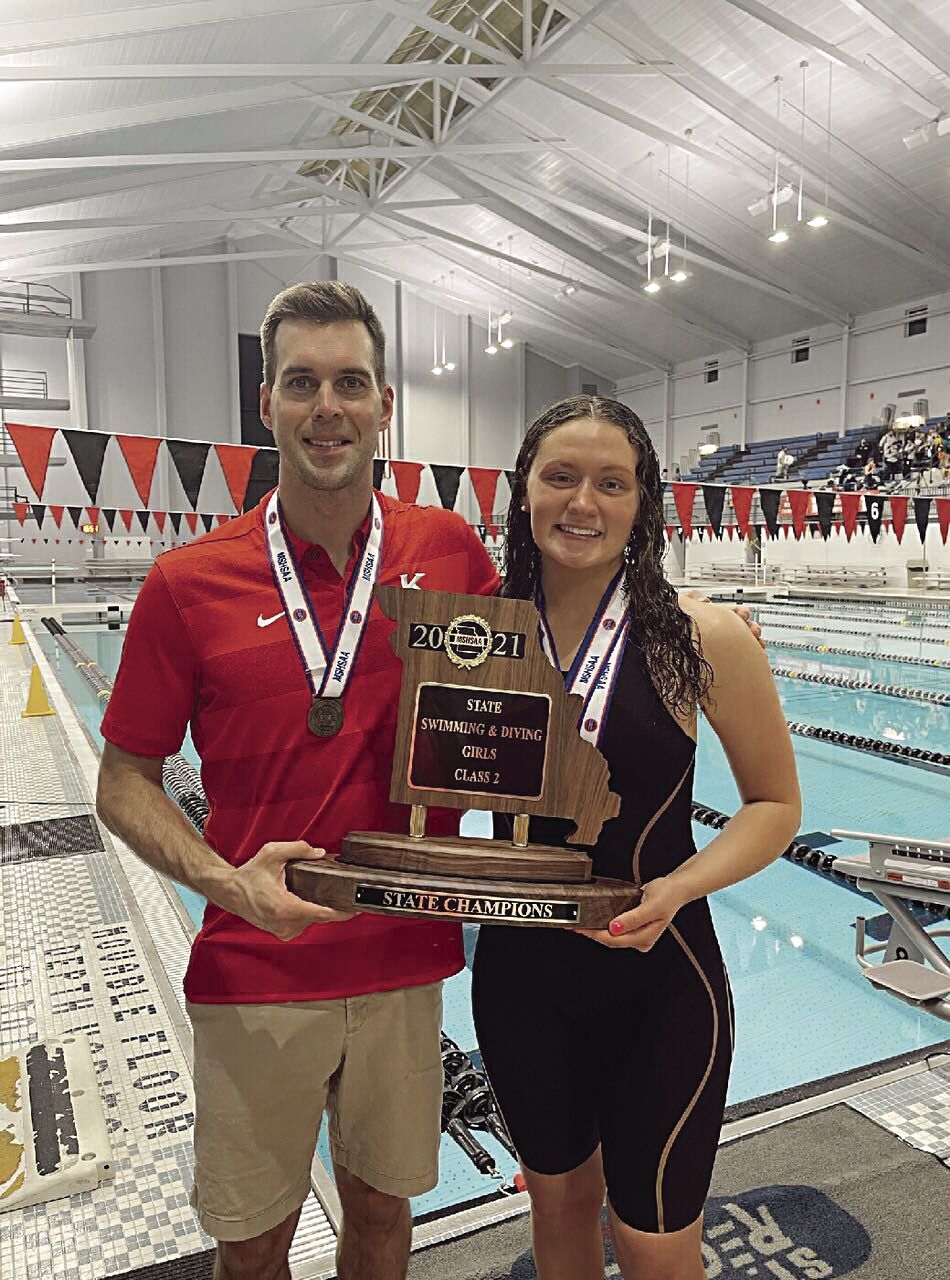 KHS Girls Swim Champs - Coach Matt Beasley and senior Ella Pearl with trophy.tif