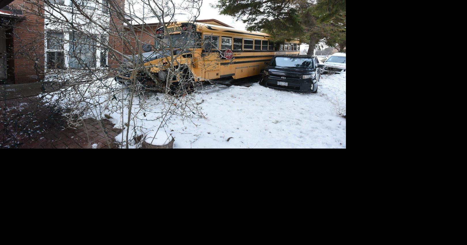 Driver taken to hospital after school bus crashes into North York home