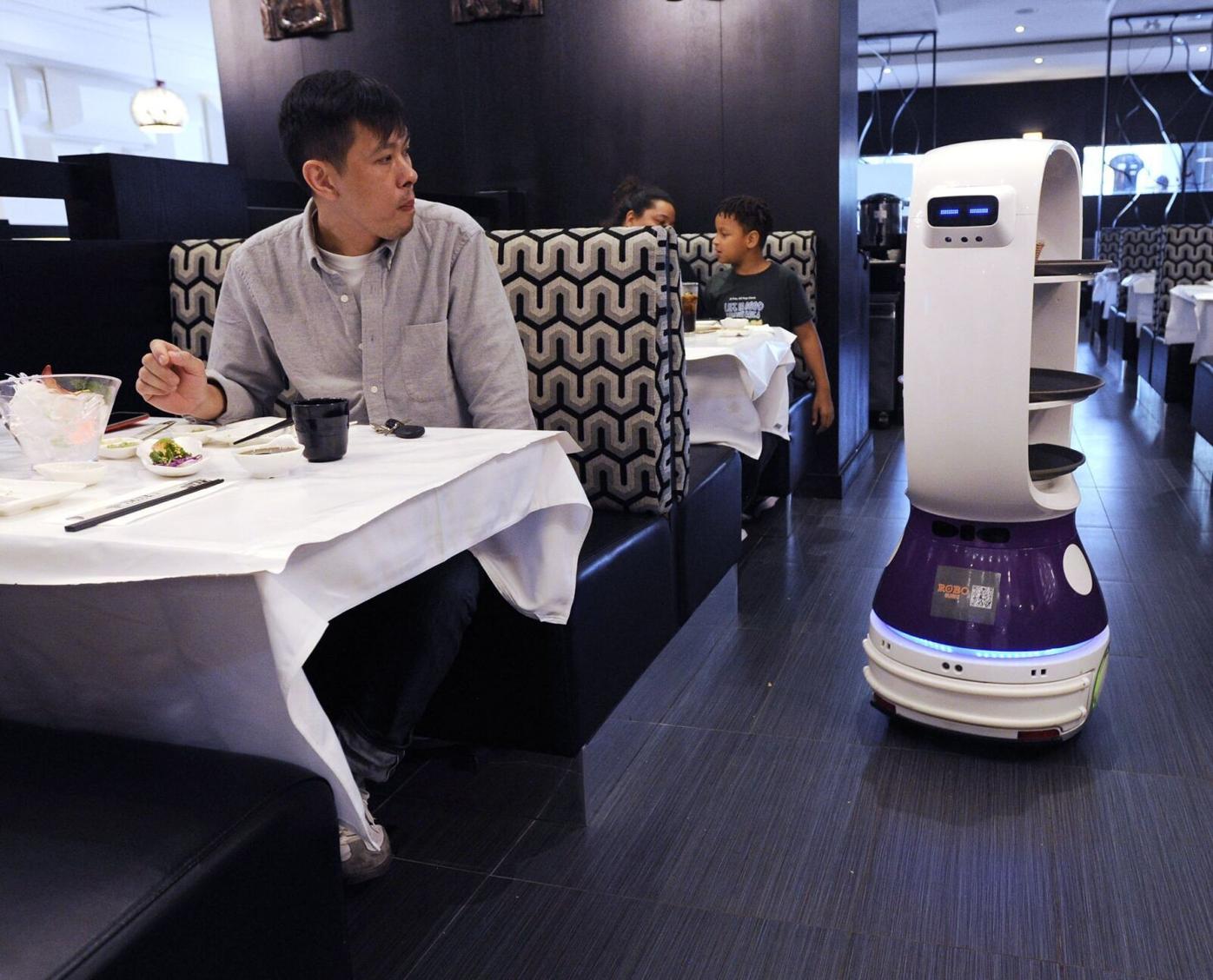 Robots serve customers at the new Robo Sushi in North York, Food And Drink