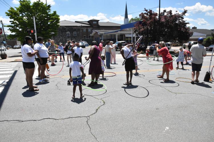 The young and the young at heart danced in the street during the Hoola Hoop Dance Party