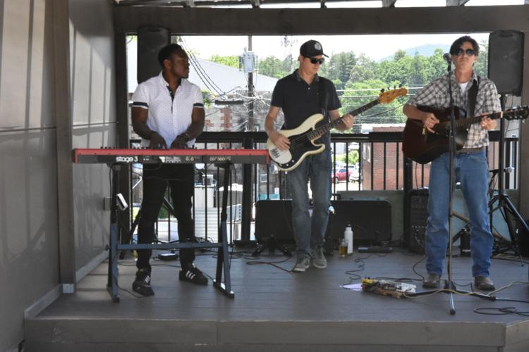 Dave Desmelik (right) and friends play in the South Broad Plaza Square..JPG