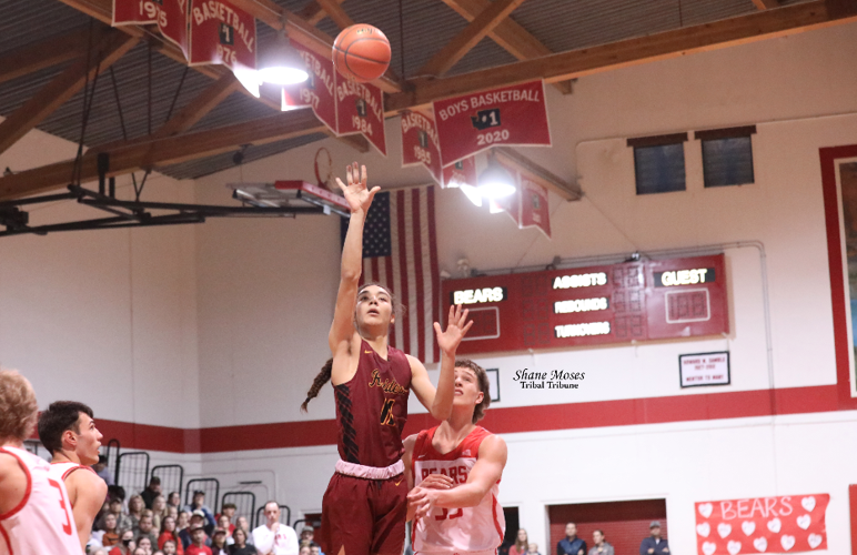 Colville tribal member Alonzo Adams (#11 maroon) of Lake Roosevelt pulls up for a floater against Brewster on Saturday (Feb.12) evening in the semifinals of the District 6 2B boys basketball tournament.