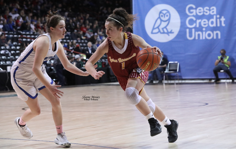 Colville tribal member Halle Albert (#1 maroon) of Lake Roosevelt dribbles to the hoop against La Conner on Friday (March 4) morning at this year’s WIAA 2B girls state tournament at the Spokane Arena.