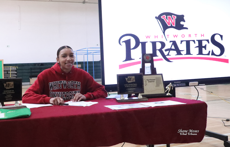 Zalissa “Z” Finley signs her letter of intent to play basketball at Whitworth University, Wednesday (April 26) morning.
