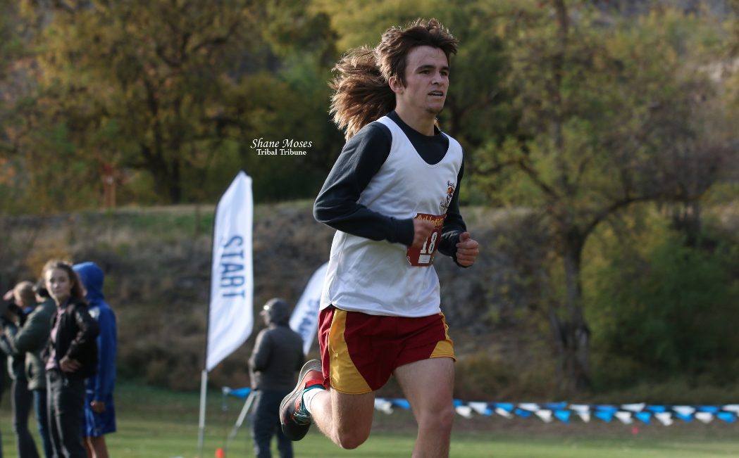 Colville tribal descendant Colton Jackson of Lake Roosevelt nears the finish line at the CWA Cross Country League Championships on Wednesday (Oct. 27) afternoon at the Okanogan Golf Course.
