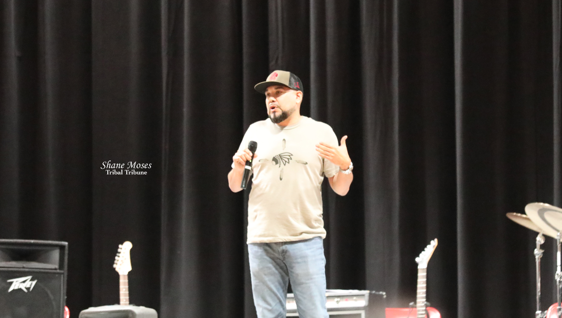 Colville tribal entrepreneur Cody Miller talks to students at Lake Roosevelt High School, on Friday (Nov. 19) morning about his clothing line "Unitary Apparel" at the first-ever Unitary Reclaim Indigenous Fashion show held at the Lake Roosevelt high sch...