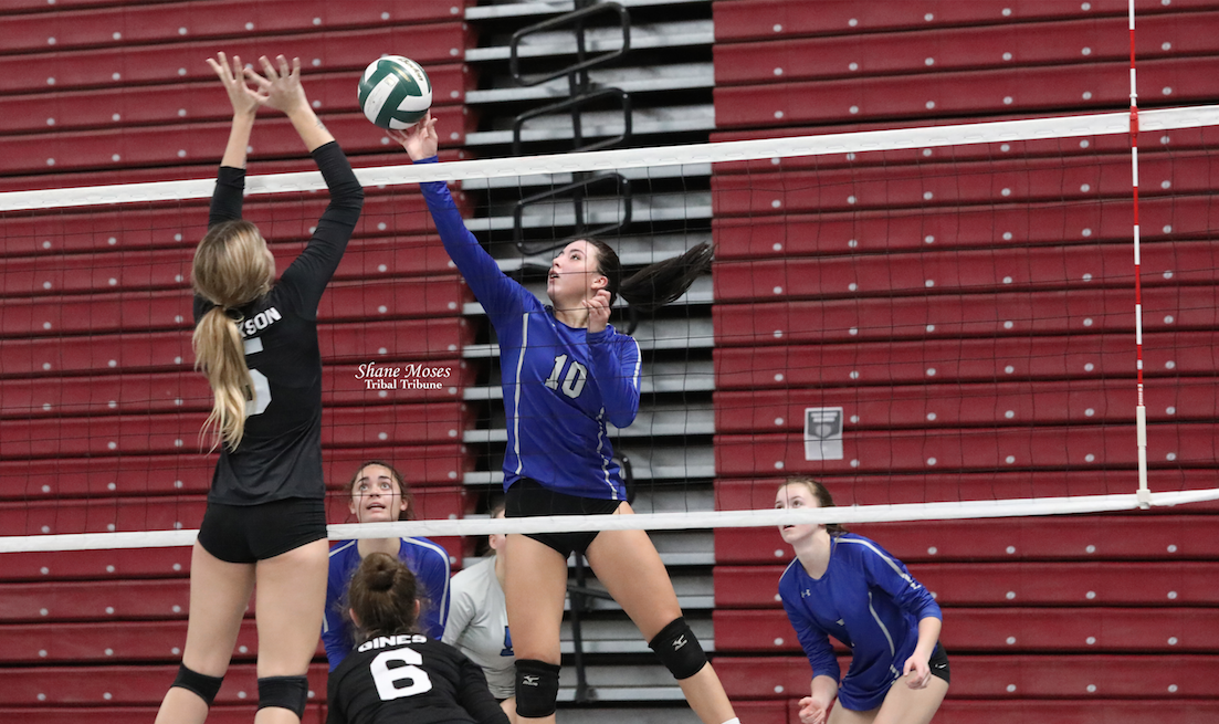 Colville tribal member Mackenzie Arden of Wilbur-Creston-Keller (#10 blue) pushes a shot over the net against Mary Walker at this year’s WIAA 1B State Volleyball tournament in Yakima at the Sundome on Friday (Nov. 12) morning.