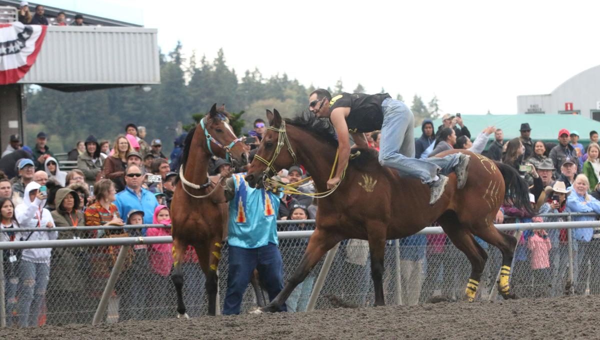 Colville tribal member Oliver Pakootas, jockey for Grizzly Mountain gets ready to leap off his horse and on to another during the first consolation race on Sunday afternoon at the third annual Muckleshoot Gold Cup at Emerald Downs racetrack in Auburn