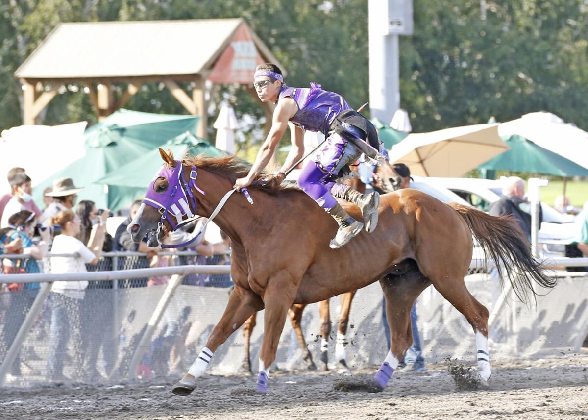 Colville tribal member Scott Abrahamson, jockey for Abrahamson Relay gets done with his exchange on Sunday (Sept. 12) afternoon in the Gold Cup Championship race