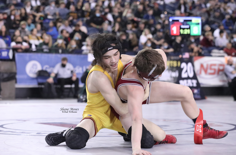 Rodger Cate (Colville tribal member) of Lake Roosevelt (gold singlet) takes on Preston Neufeld of Reardan in the WIAA 1B/2B state championship match at 106-lbs on Saturday (Feb. 19) evening at the Tacoma Dome.