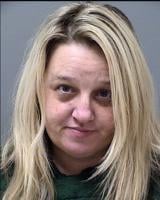 Woman in middle school gun case arrested again