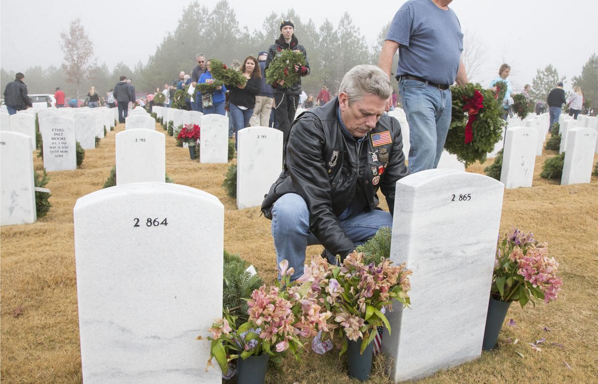 National Cemetery honors veterans with wreathlaying Local