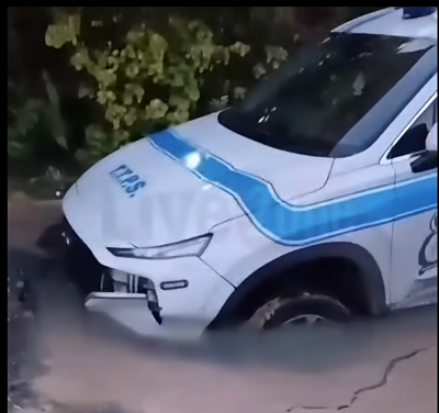 Police vehicle dives into WASA pothole