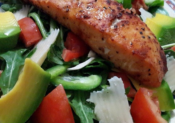 Mixed green salad with salmon
