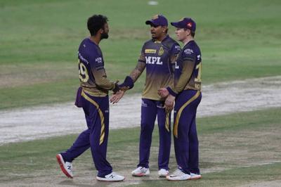 Eoin Morgan, Sunil Narine and Varun Chakaravarthy