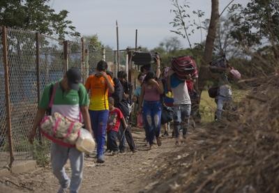 Their money worthless, Venezuela's desperate flee by foot ...