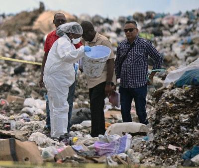 How did buckets of human remains get to dump?