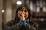 A parishioner weeps yesterday