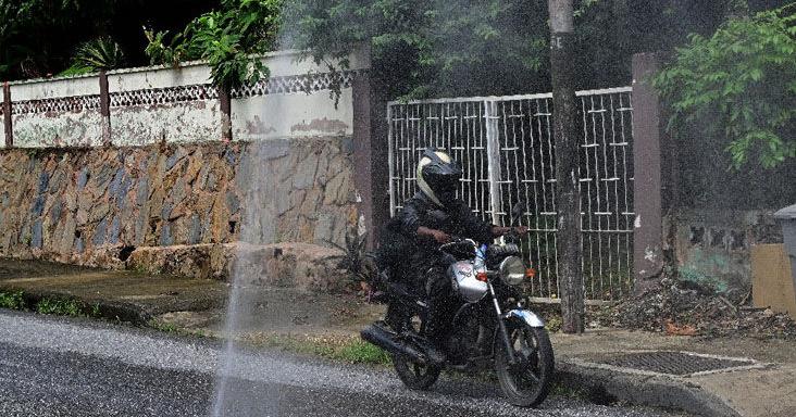 Water spouts high from Maraval pothole