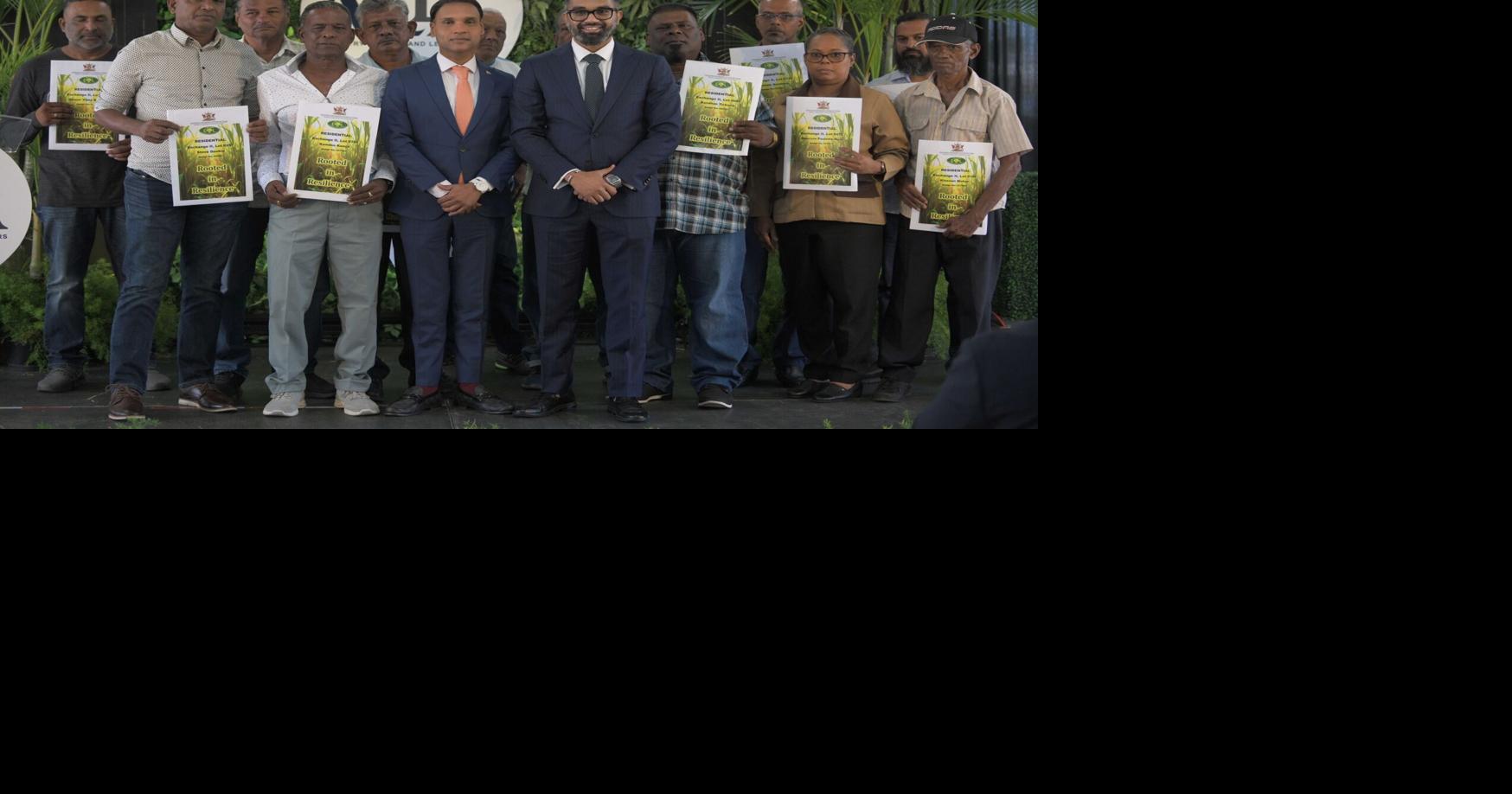 250 ex-Caroni workers get leases after decades-long wait