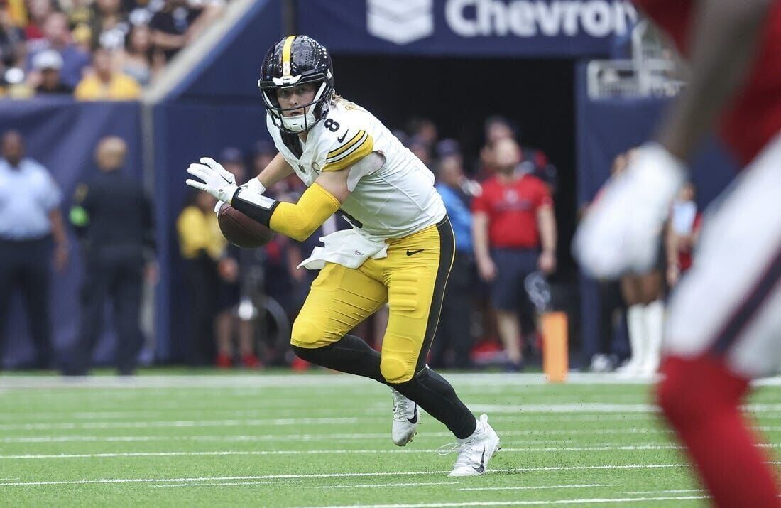 Pittsburgh Steelers quarterback Kenny Pickett (8) sands beside the