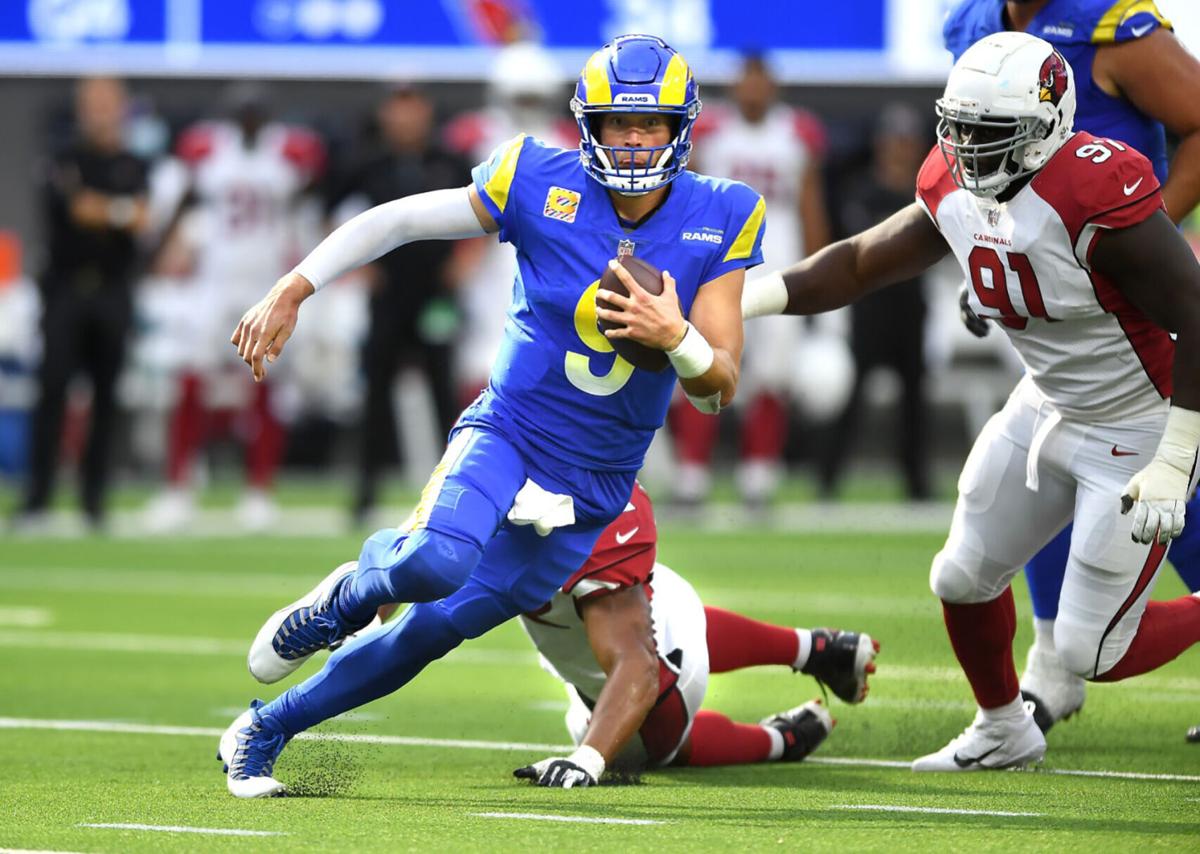 Rams quarterback Matthew Stafford scrambles for a first down against the Cardinals in the fourth quarter at SoFi Stadium on October 3, 2021.