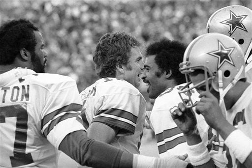 Roger Staubach and Drew Pearson, right, exchange smiles after their fourth  quarter pass play set up for the winning field goal by the Dallas Cowboys  in the last three seconds of their