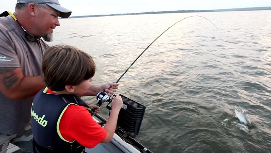 Fishing fascination, guide's patience provide autistic boy with