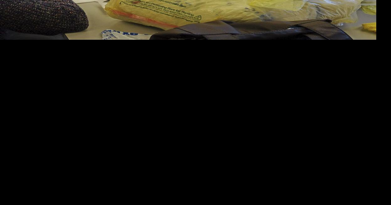 Volunteers making mats for the homeless