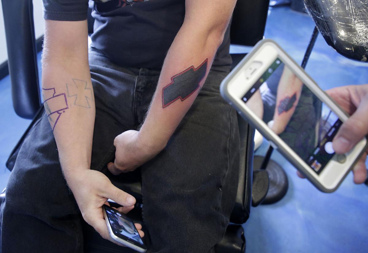 'I was young and dumb' Tattoo parlor's promotion to cover hate, gang
