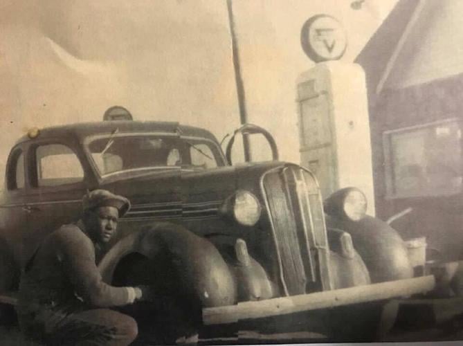 Ullyses G Threatt checking tires