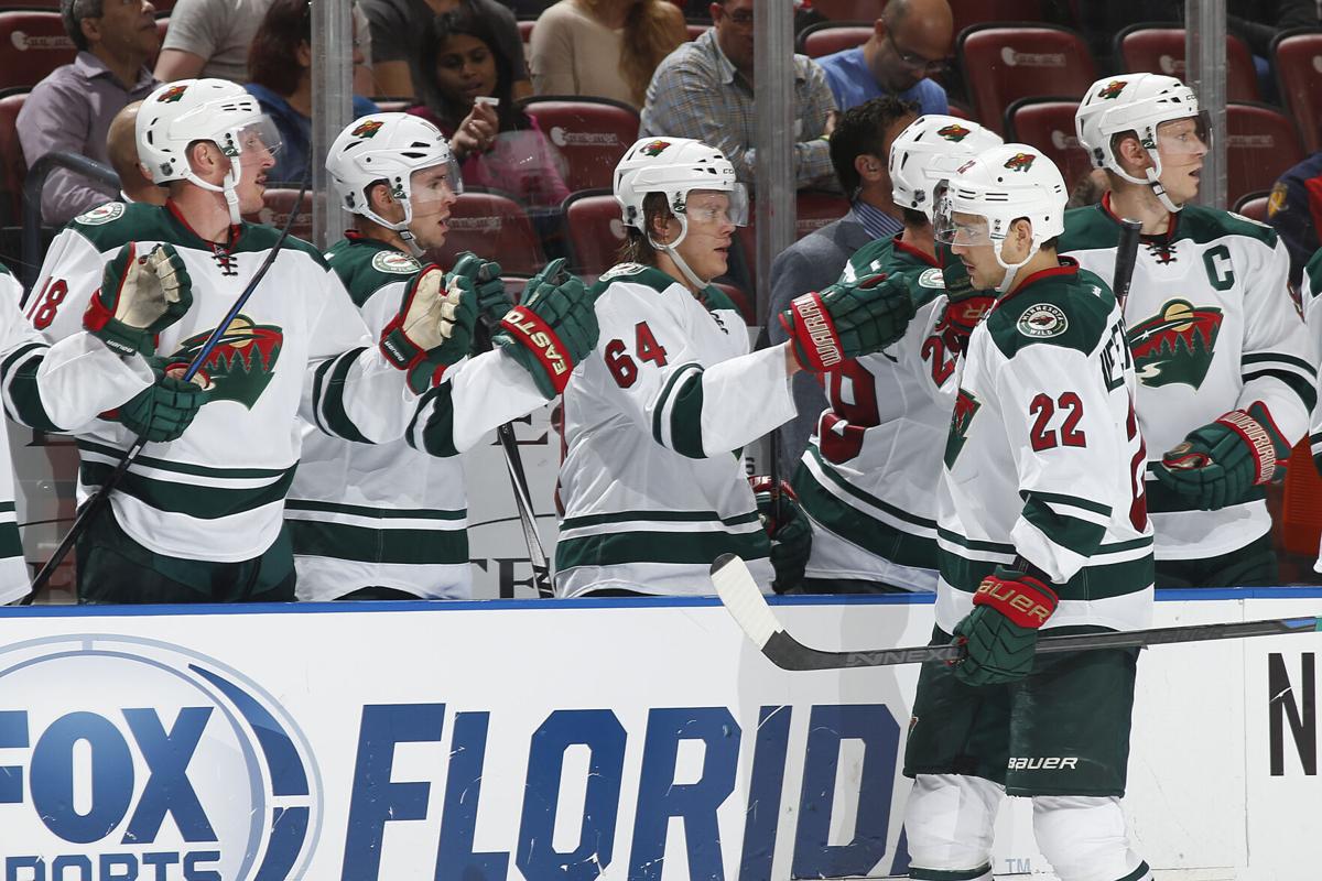 Nino Niederreiter #22 of the Minnesota Wild is congratulated by teammates after scoring a first-period goal against the Florida Panthers at the BB&T Center on November 24, 2014, in Sunrise, FL..