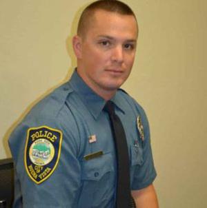 A Virginia police officer rescued a couple from a burning home. He went back in for the dog.