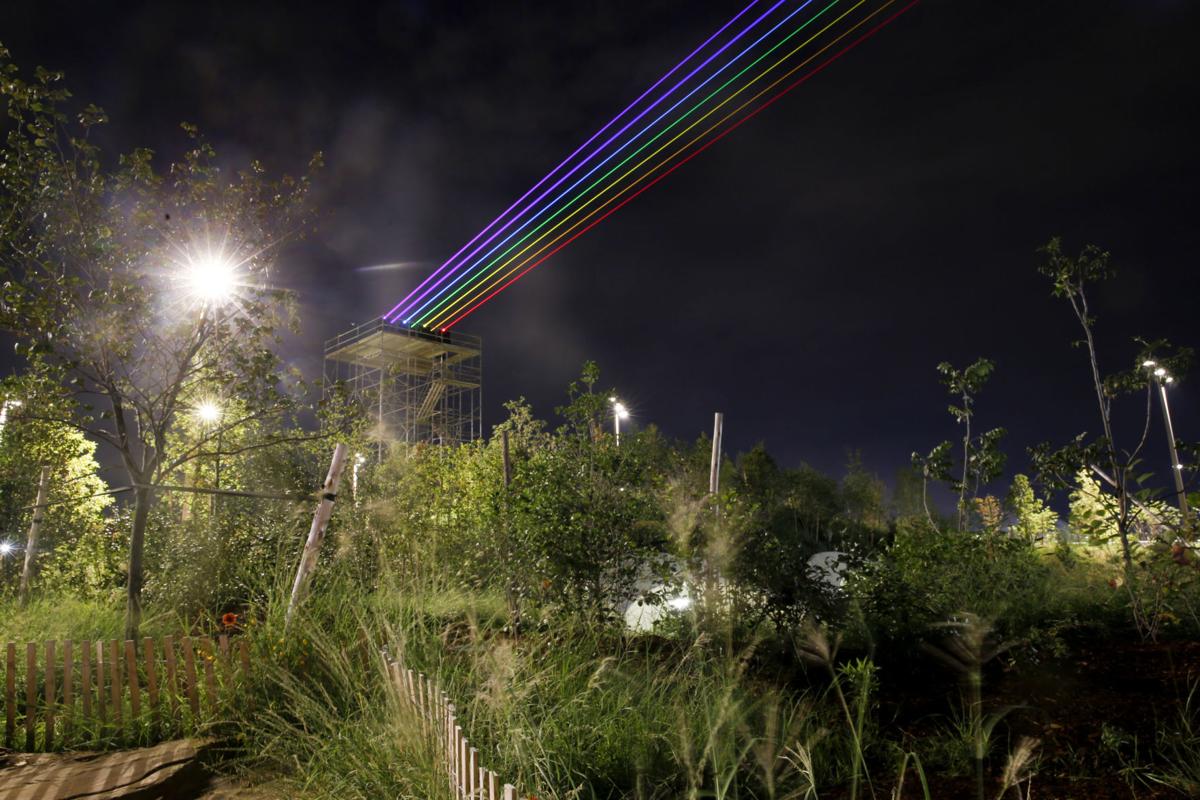 gathering place rainbow lasers wash over tulsa as a light for hope