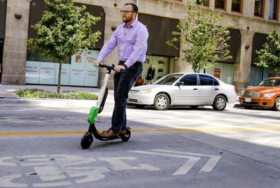 City Proposes Rules For Electric Scooter Bicycle Businesses Local Oklahoman Reporter David Dishman Rides One Of The New Lime Scooters In Downtown Oklahoma City August Chris Landsberger